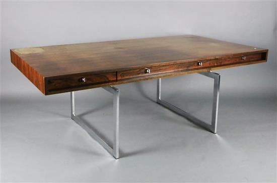 A Bodil Kjær rosewood freestanding working table desk with underframe of chromed steel W.6ft 7in. D.3ft 3in. H.2ft 3in.
